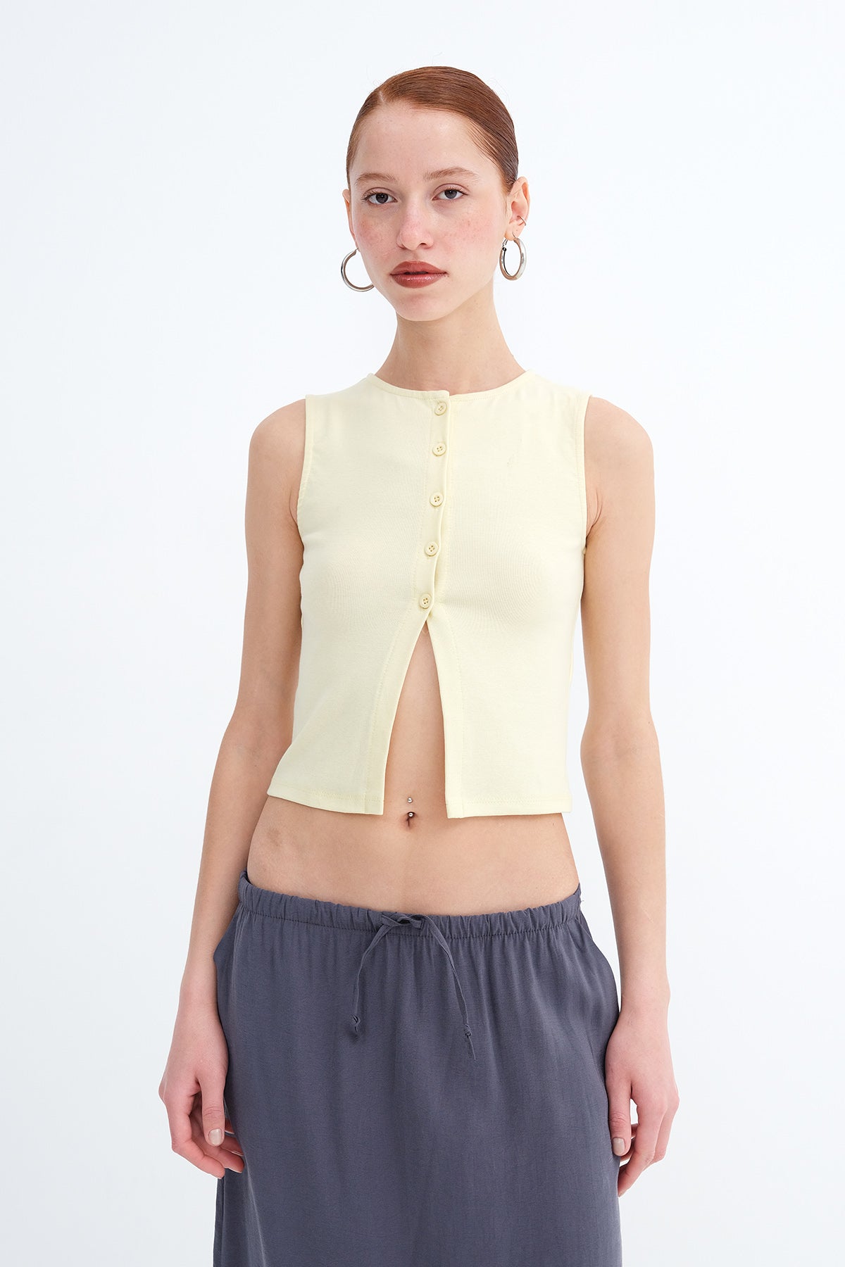 Light-Yellow_Sleeveless-Buttoned-Blouse-addax