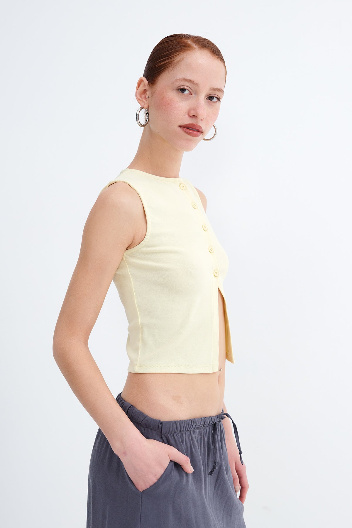 Light-Yellow_Sleeveless-Buttoned-Blouse-addax