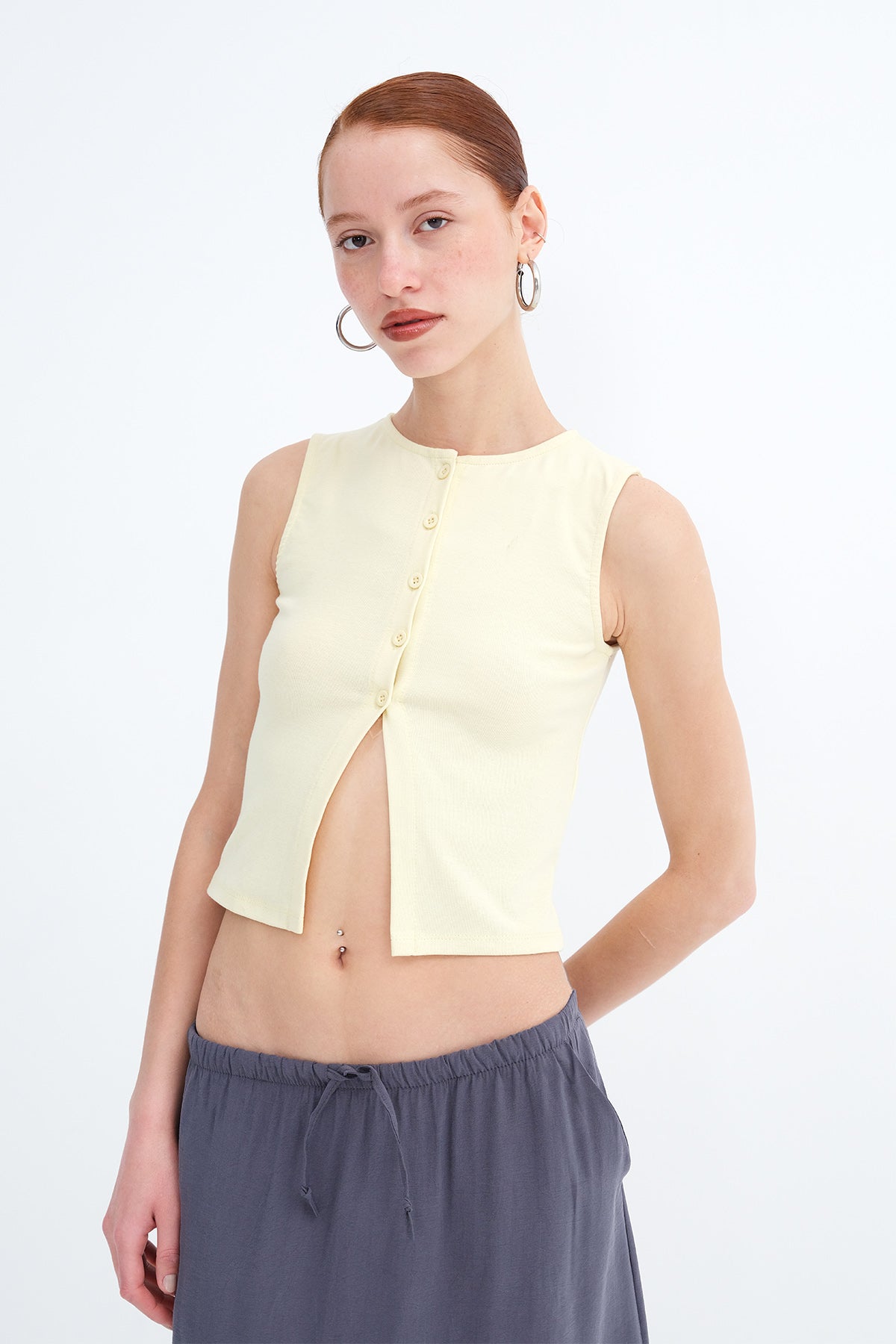 Light-Yellow_Sleeveless-Buttoned-Blouse-addax