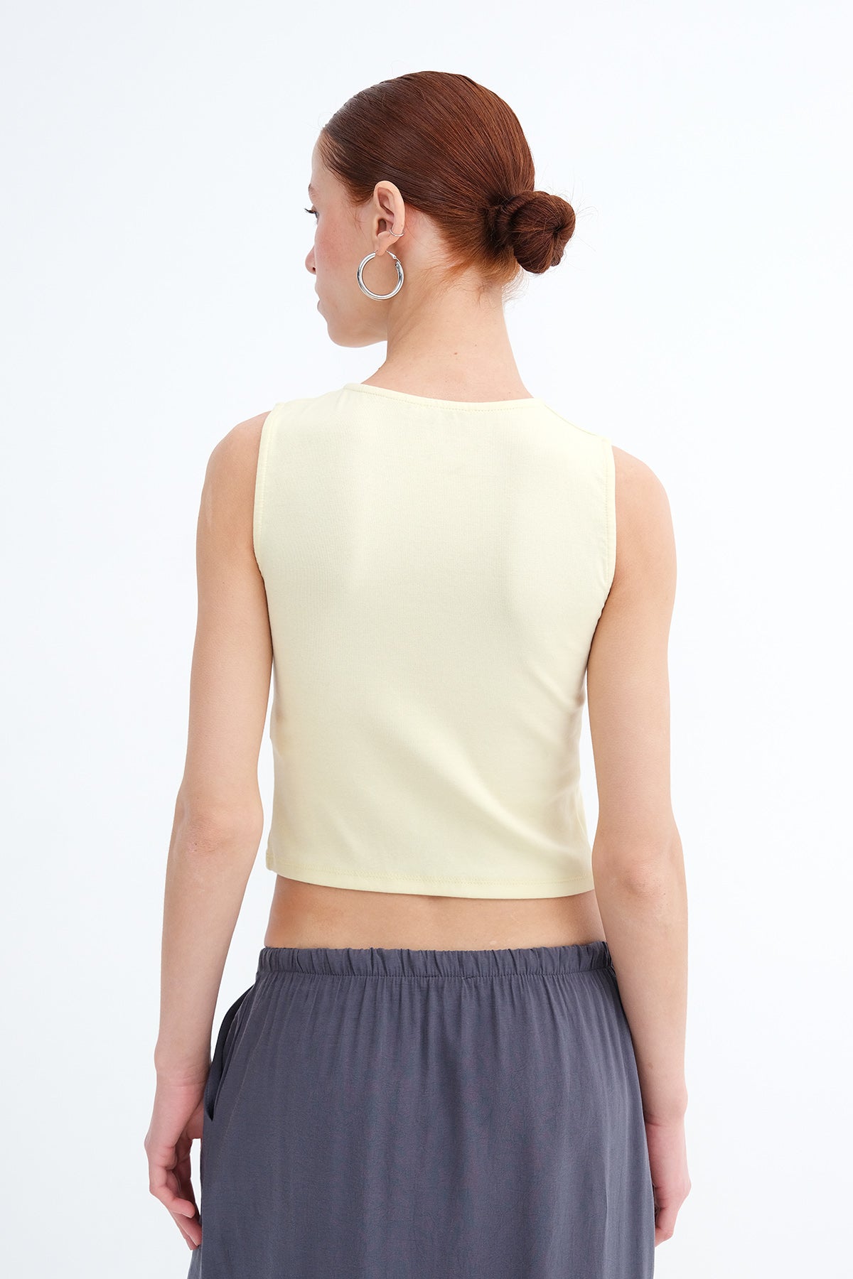 Light-Yellow_Sleeveless-Buttoned-Blouse-addax